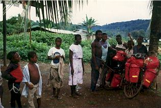 Villagers are helping cleaning off the muddy bicycle